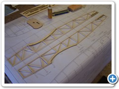 The fuselage side frames are built directly over the plans.