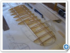 Assemble the center section first, then rock the wing over and build the first panel directly over the plans.