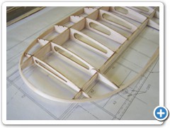 The leading and trailing edges and tip bows are added to the wing panel assembly after the basic rib and spar assembly is glued together.