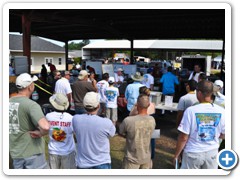 Pilots gather around the raffle table to see if they won one of the $25,000 in donated prizes