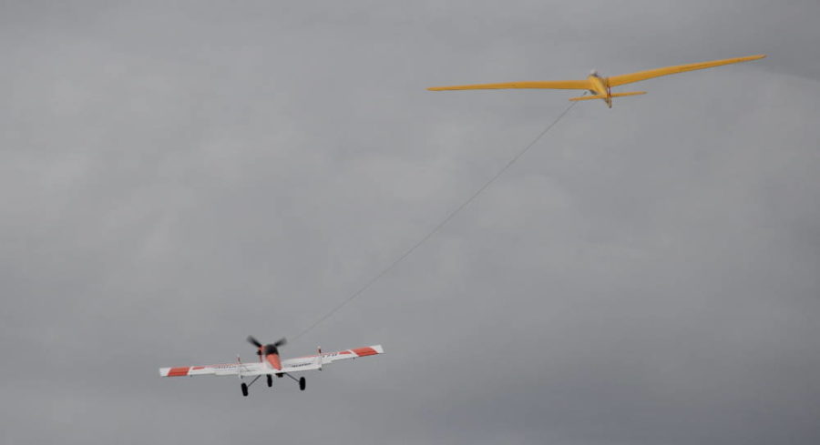 John Mears from Birmingham, AL, having his unique looking 1950’s style Mosey 4 towed aloft by Scot Stewart’s Bidule tow plane.